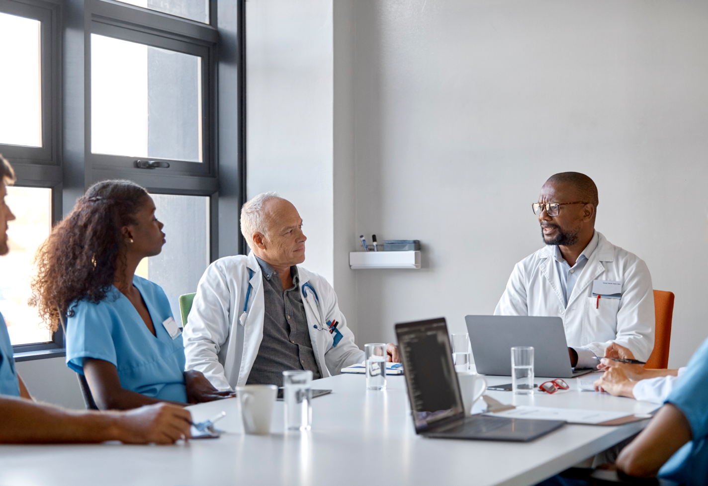 A group of medical professionals in a meeting.